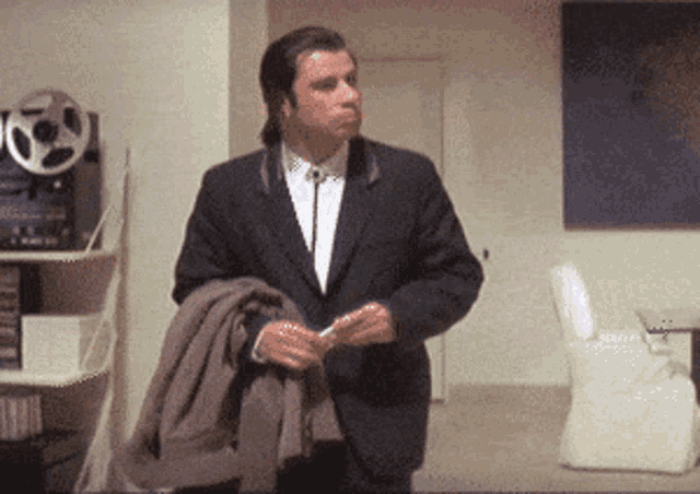 "Confused John Travolta looking for something"
